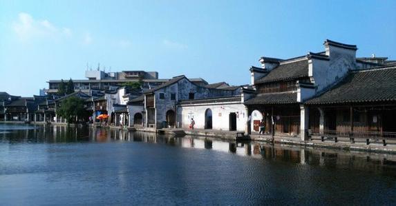 乌镇、西塘与南浔,哪个古镇更有趣味?,乌镇、西塘与南浔,古镇魅力大比拼,哪个更有趣味?